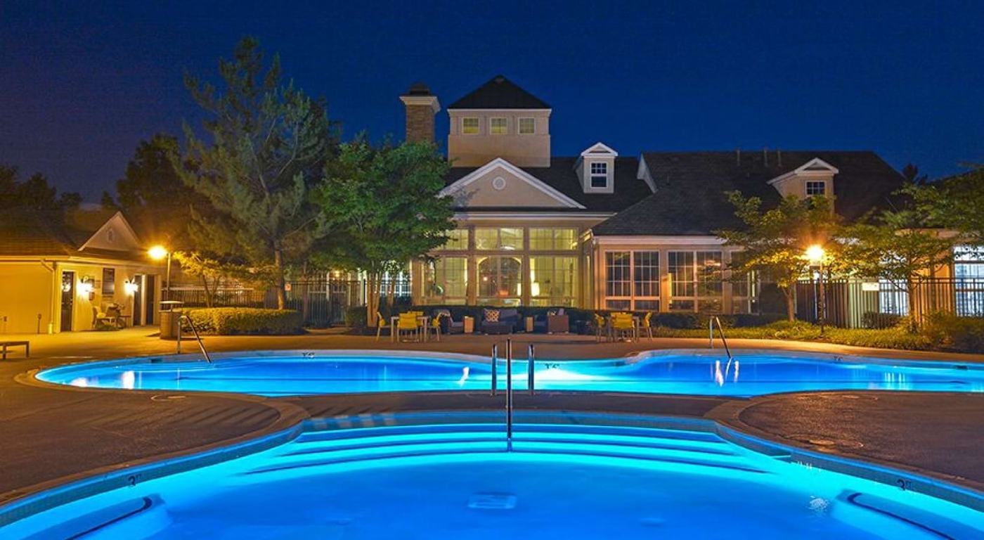 The Ashborough pool and clubhouse at night